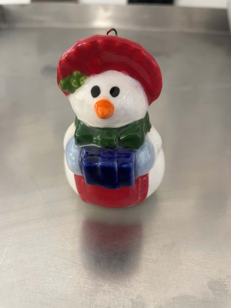 a finished painted snowman decoration